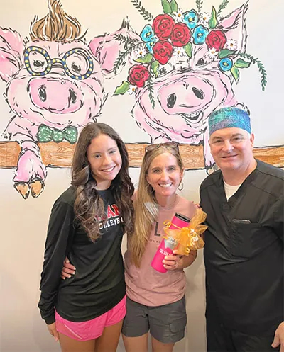 Dr. Wilkerson with one of his pediatric patients and her mom