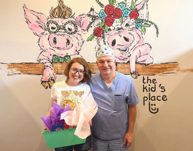 Dr. Wilkerson of The Kid's Place in Boerne, TX with a pediatric patient
