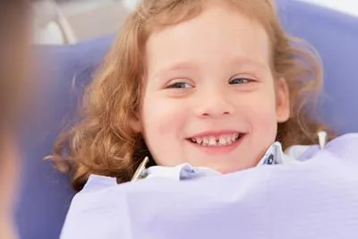 pediatric patient smiling during her dental appointment at The Kid's Place in Boerne, TX